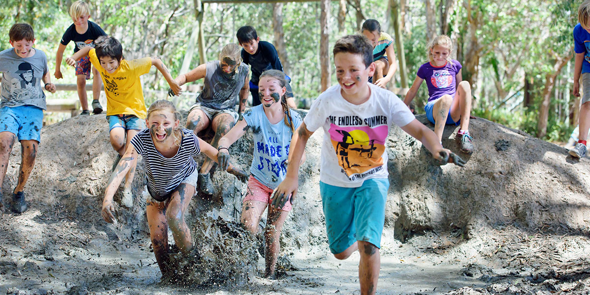 Running Through the Mud at Apex Adventure Camp Sunshine Coast