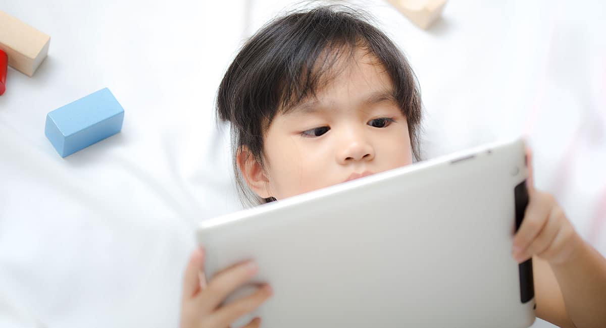 child reading digital book