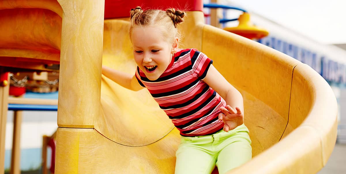girl playing on slide