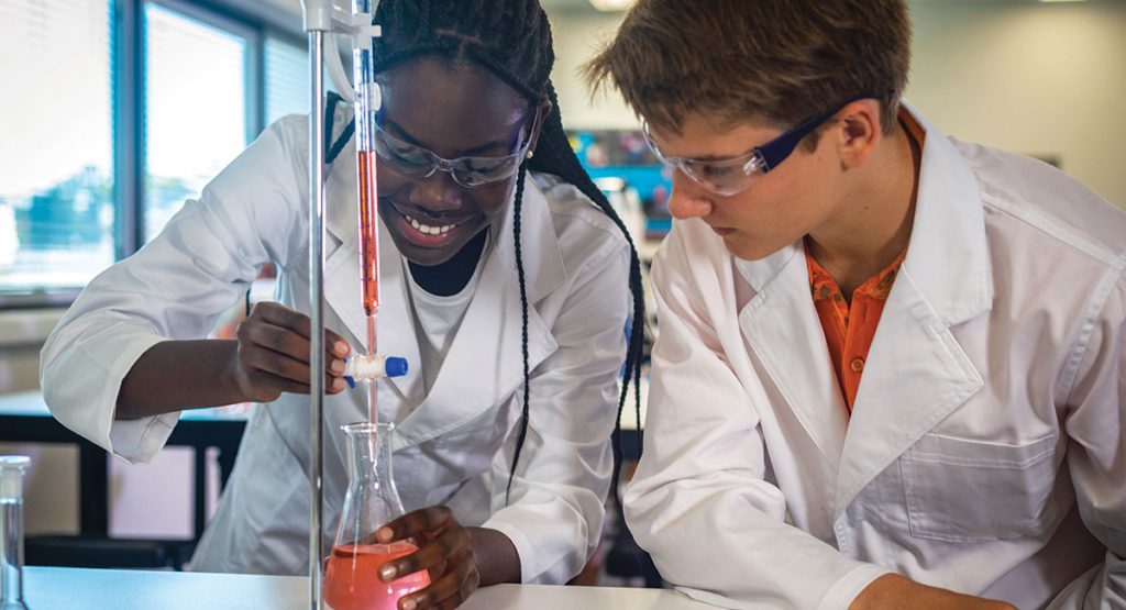 Students at Ies College Doing a Science Experiment As Part of the Ib Diploma