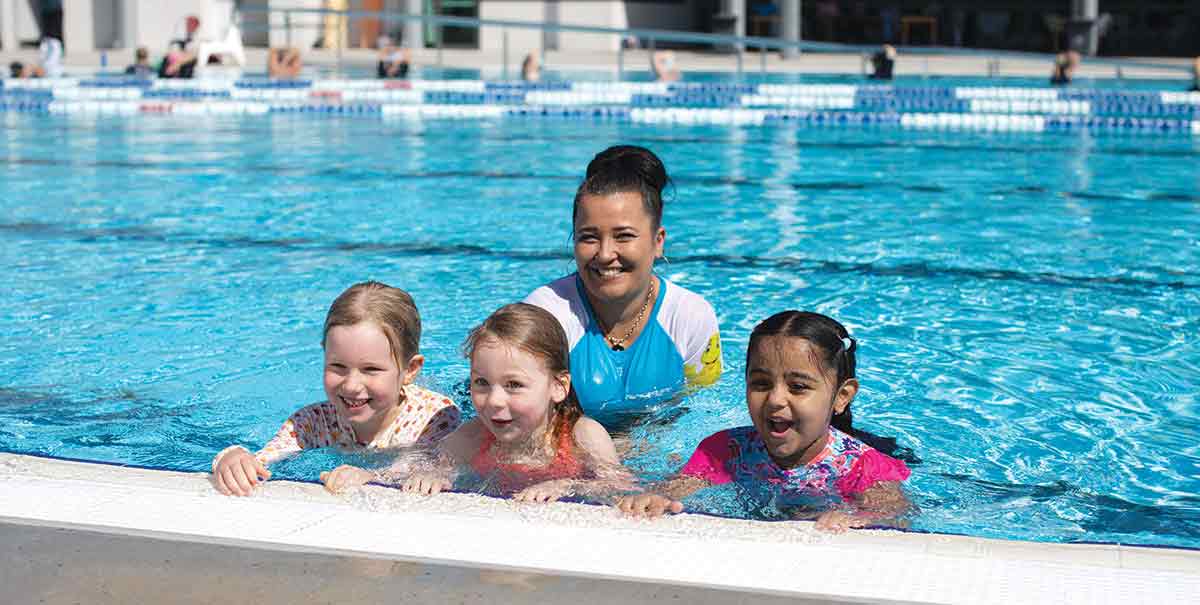 learn to swim class in outdoor pool
