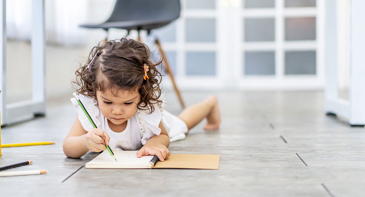 Little girl learning to write