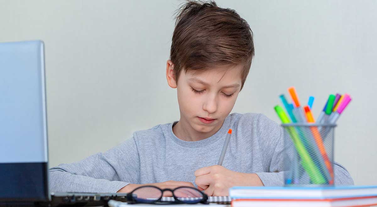 Left Handed Schoolboy Writing