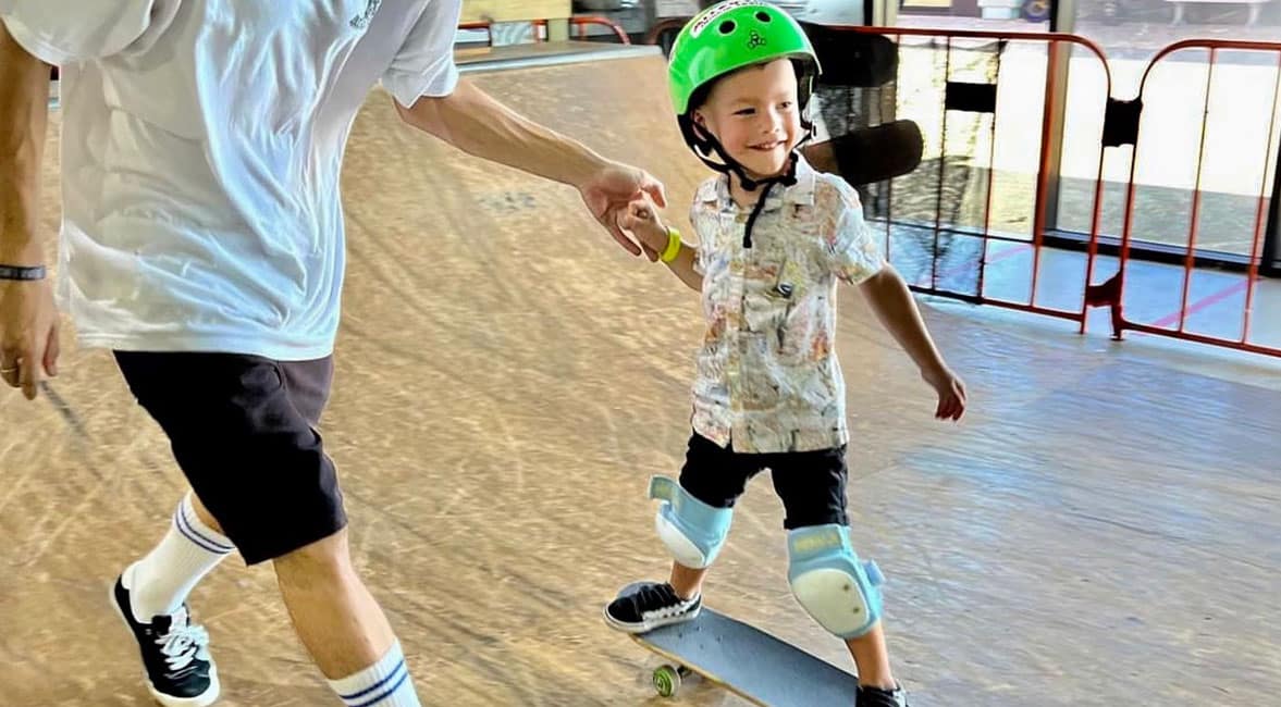 Learning to skateboard at Alley Oops Skateboard Park