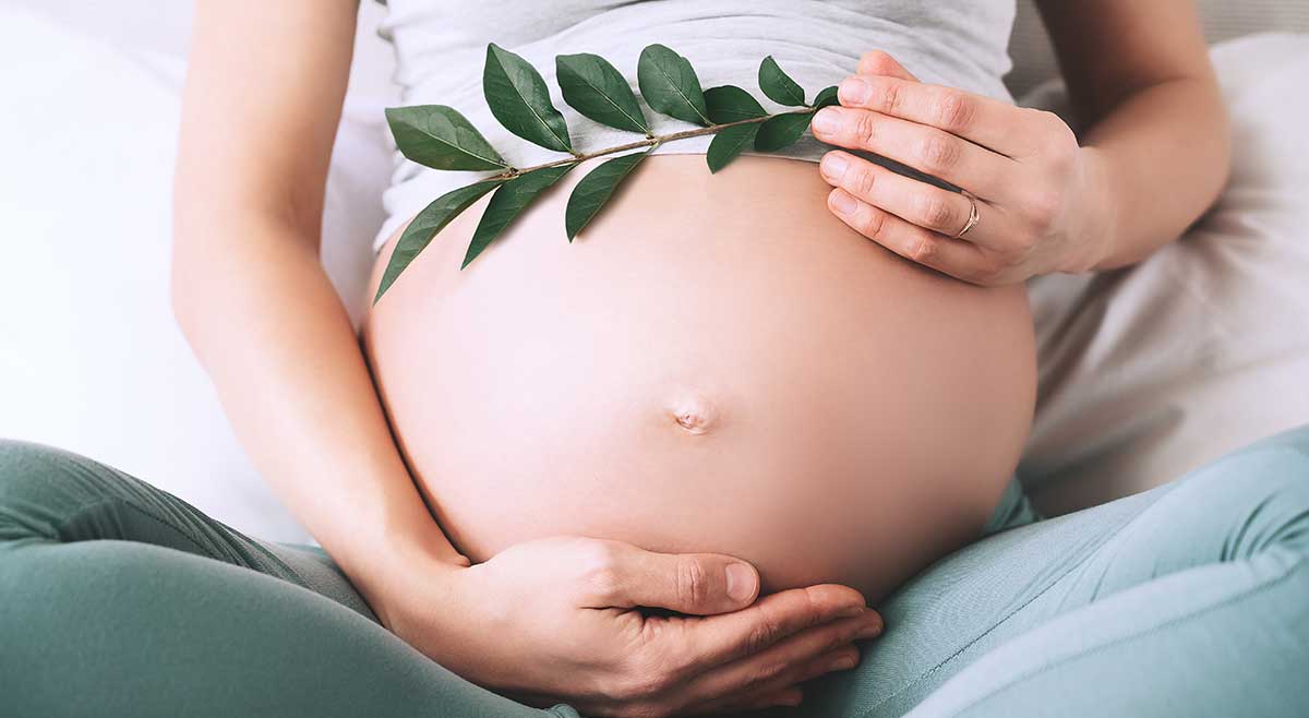 Woman Holding Pregnant Belly Learning Hypnobirthing