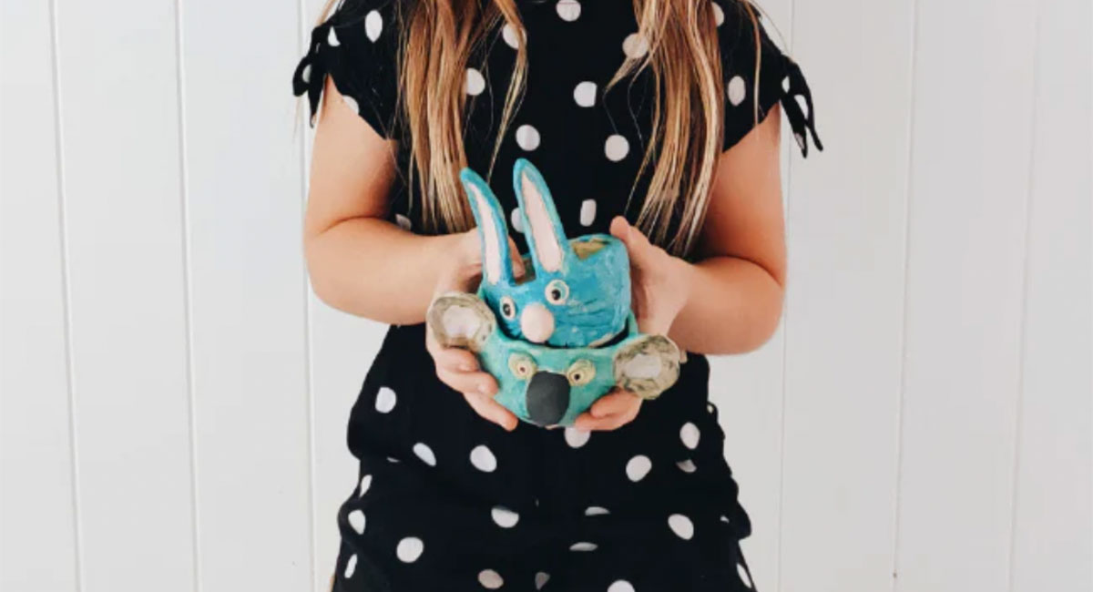 Girl Holding Animal Pottery Project