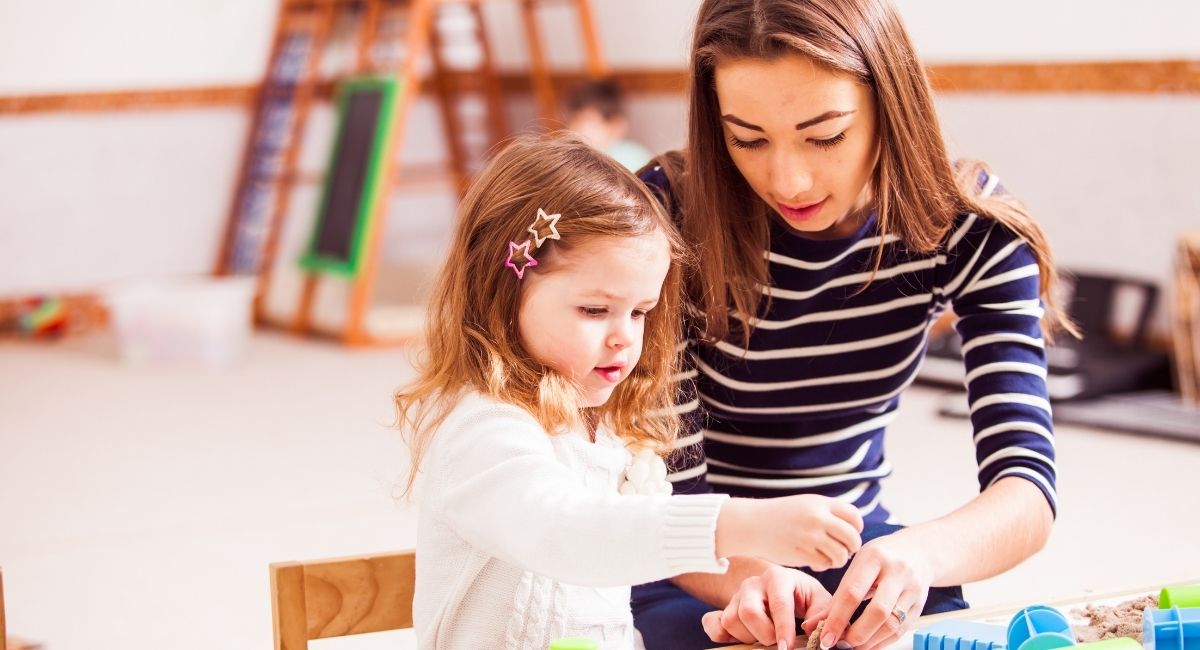 Young Girl with Autism Learning with Mum