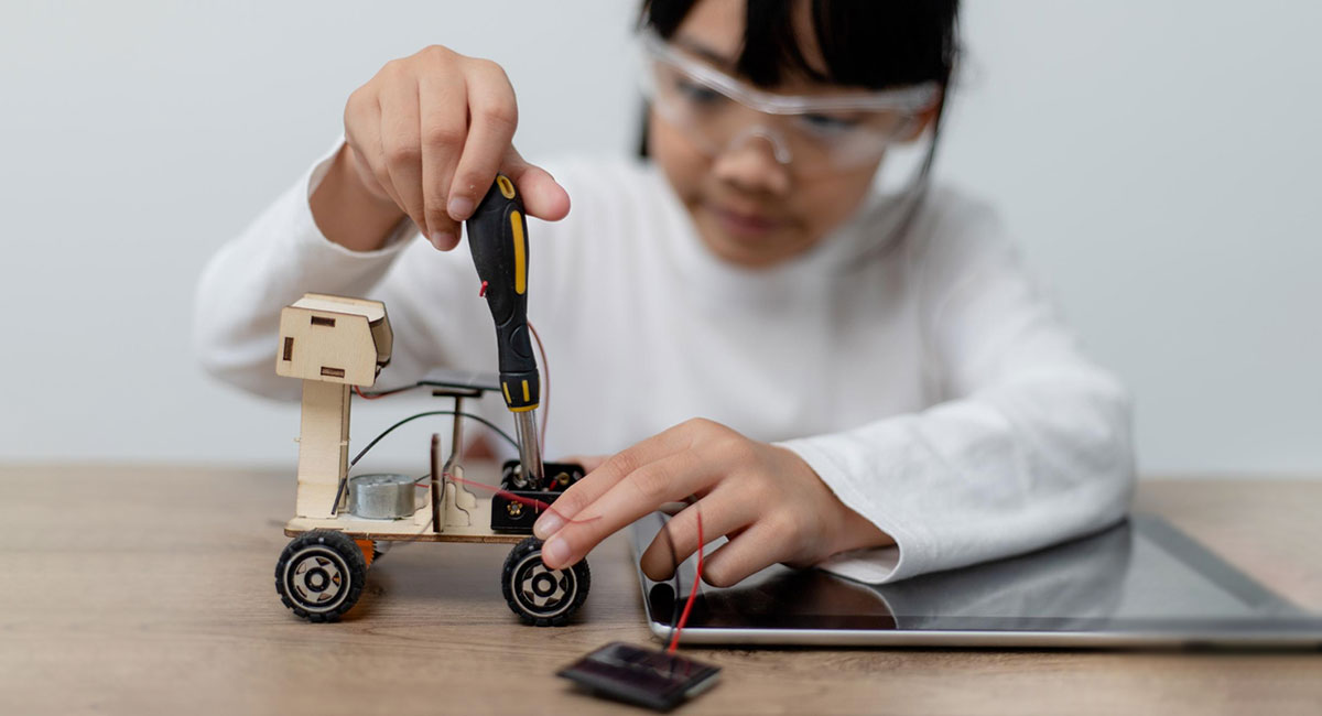 Girl Wiring Robot As a Career of the Future