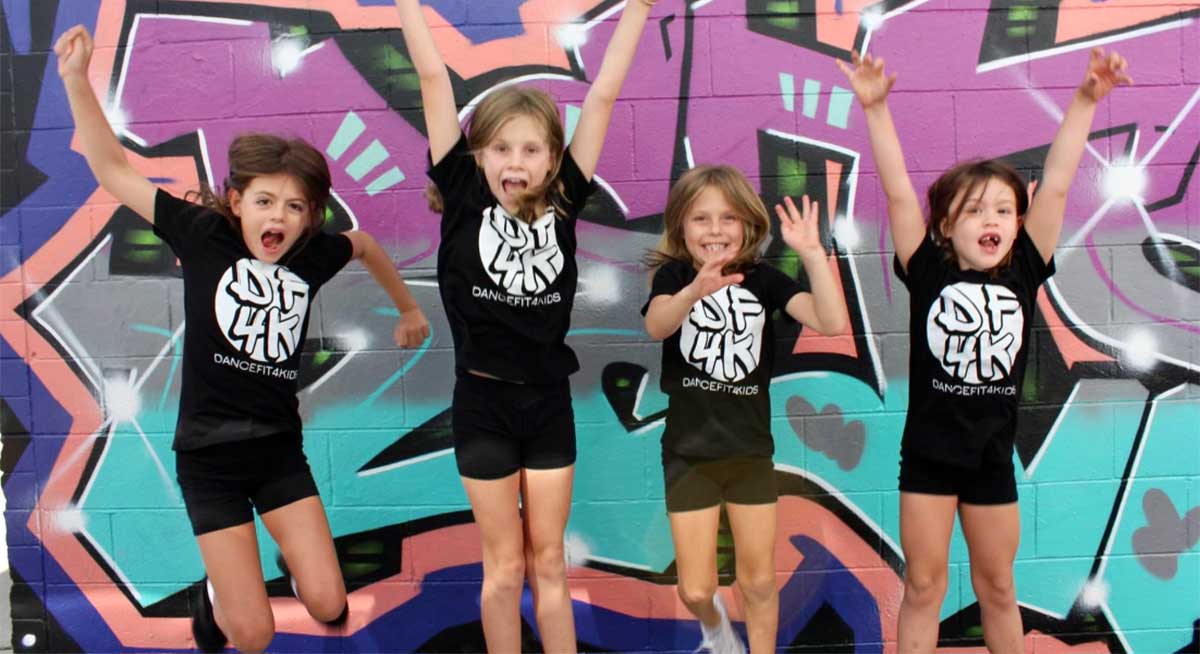 Kids Jumping in the Air Having Fun at Dance Fitness 4 Kids Summer Holiday Camp