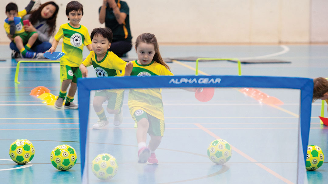 Preschoolers Kicking Footballs into Goals at Brazilian Skills Sunshine Coast Soccer Program
