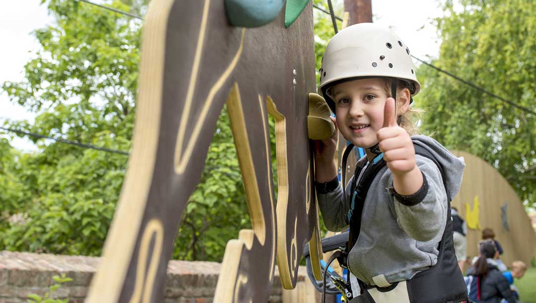 Child Climbing Rope Course As Experience Gift for Earth Month