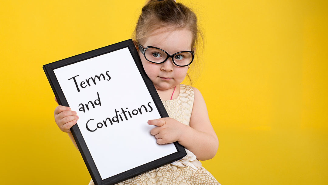 Little Girl Holding Sign That Reads Terms and Conditions