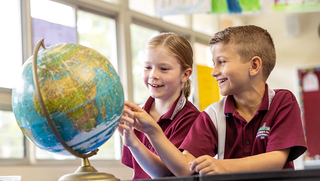 Students learning about the world at Sacred Heart, Sandgate
