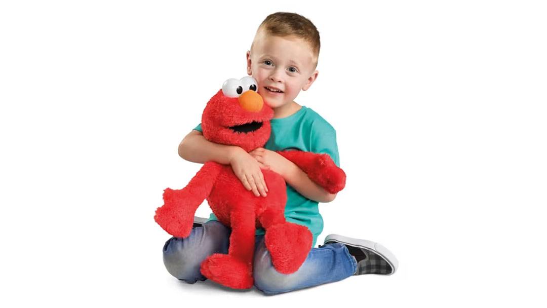 Boy Playing with New Release Tickle Me Elmo Toy