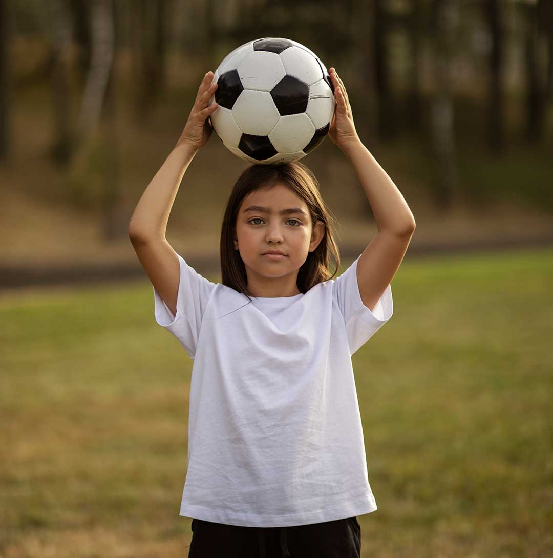 Portrait of Girl Holding a Football