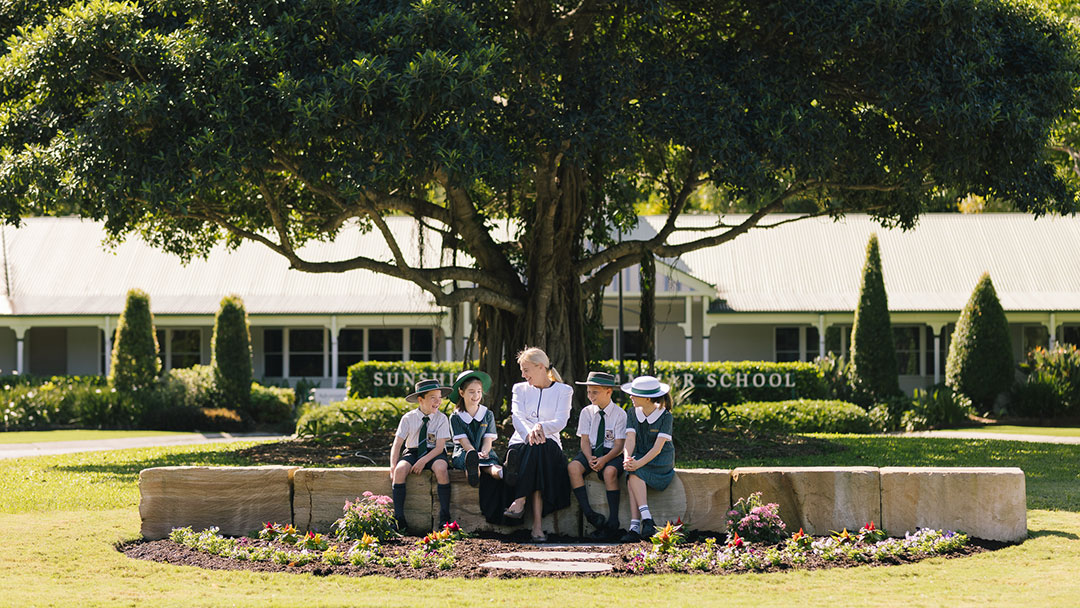 Sunshine Coast Grammar School Principal Anna Owens with Students at the School Entrance
