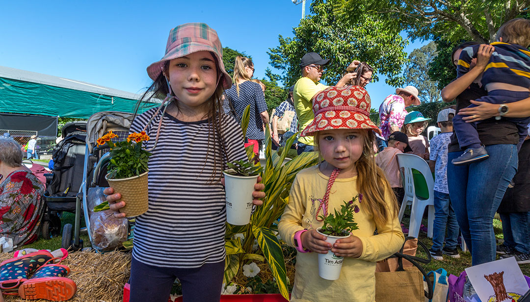 Children with potted plants at the Queensland Garden Show