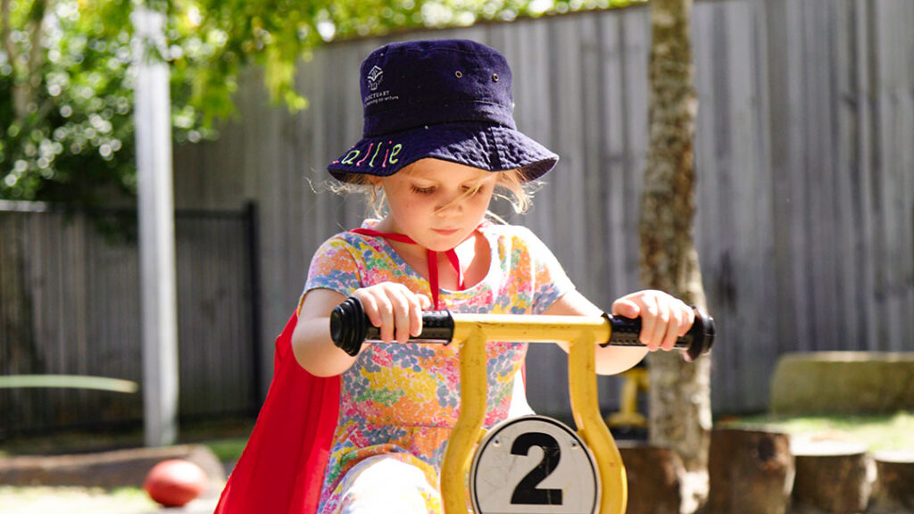 Sanctuaryearlylearningbuderimridingtrike | Kids in Brisbane Gold Coast Sunshine Coast | Kotc Riding a Trike at Sanctuary Early Learning Buderim