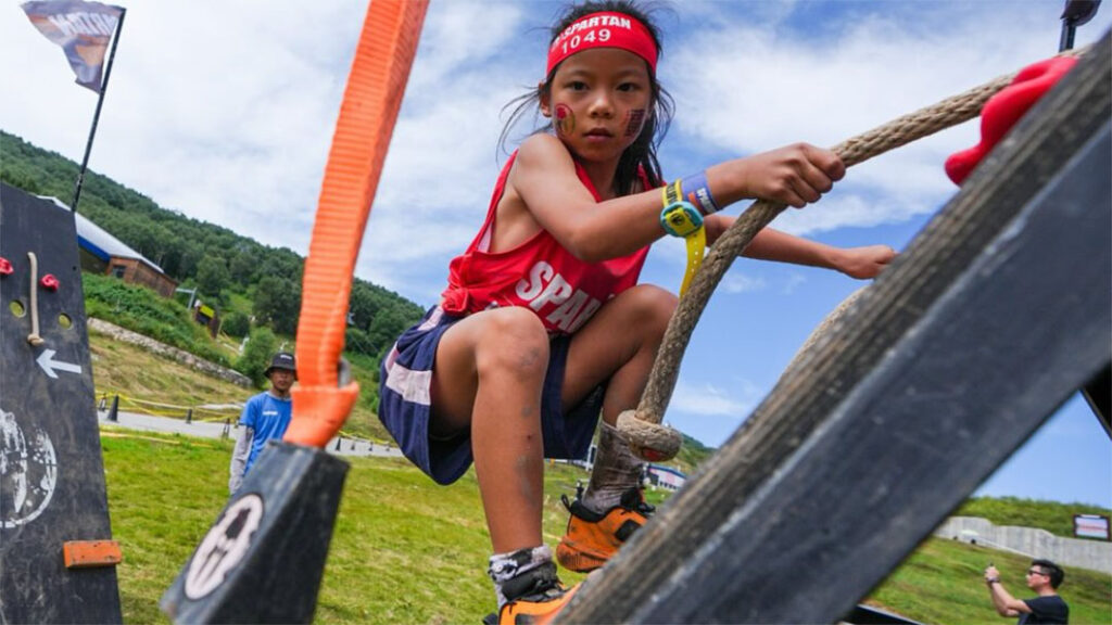 Spartan-moreton-bay-2 | Kids in Brisbane, Gold Coast, Sunshine Coast | Kotc Young Girl Climbing a Pole at the Spartan Kids Race