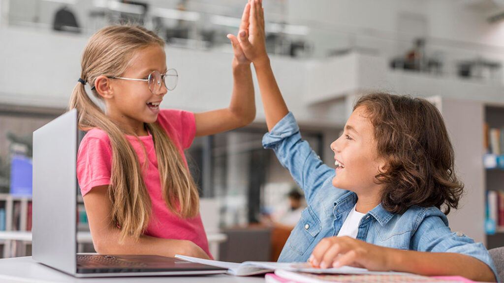 Happy Students Giving a High 5 to Illustrate Student Motivation