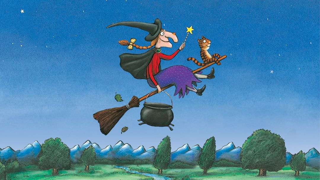 Whimsical witch riding a broom with a cat, a cauldron dangling below, under a starry night sky over a green landscape.