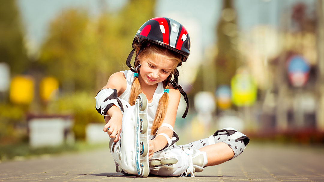 Girl Putting on Inline Skates
