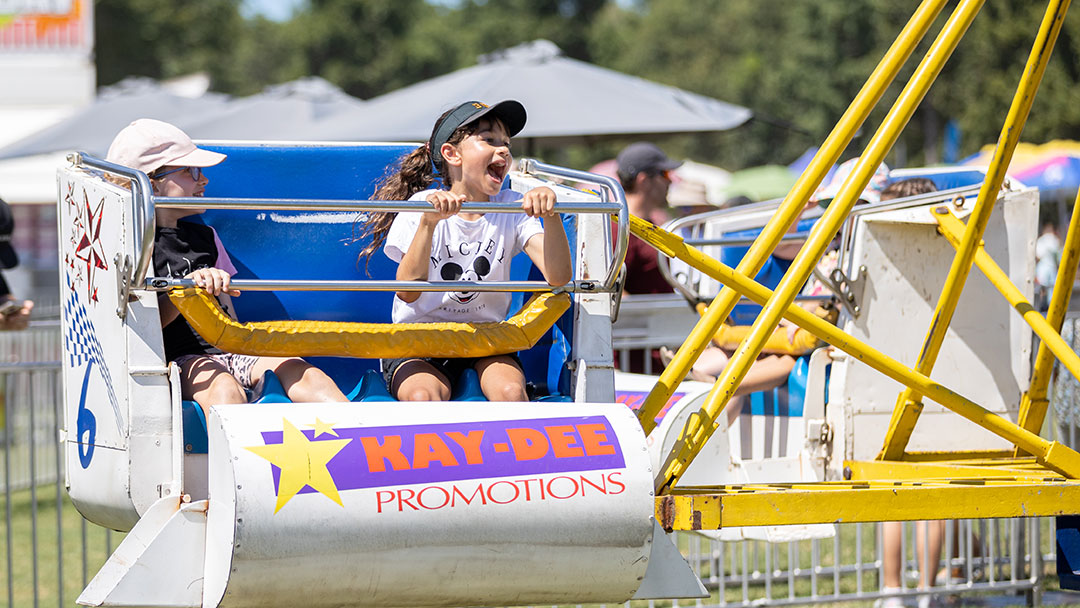 Moreton-kids-festival-young-girl-on-ride1080x608 | Kids in Brisbane, Gold Coast, Sunshine Coast | Kotc Fun Fairground Rides at Moreton Kids Festival