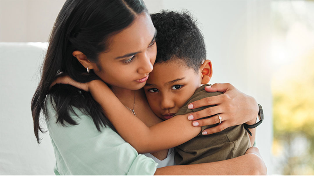 Mother Comforting Son After Visiting Emergency Dentist in Brisbane