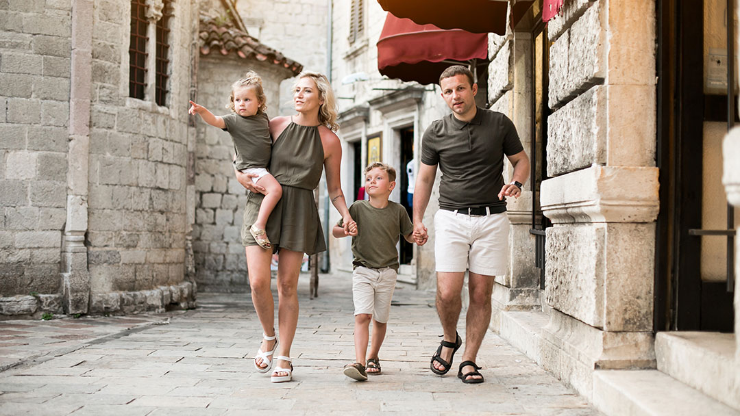 Family Wandering Streets Together on Family Trip