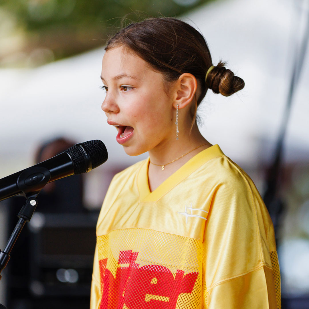 Noosa-alive-talent-2026-1 | Kids in Brisbane, Gold Coast, Sunshine Coast | Kotc Girl Singing at Stars Alive!, the Noosa Alive! Talent Competition. Credit @ian Waldie Photography