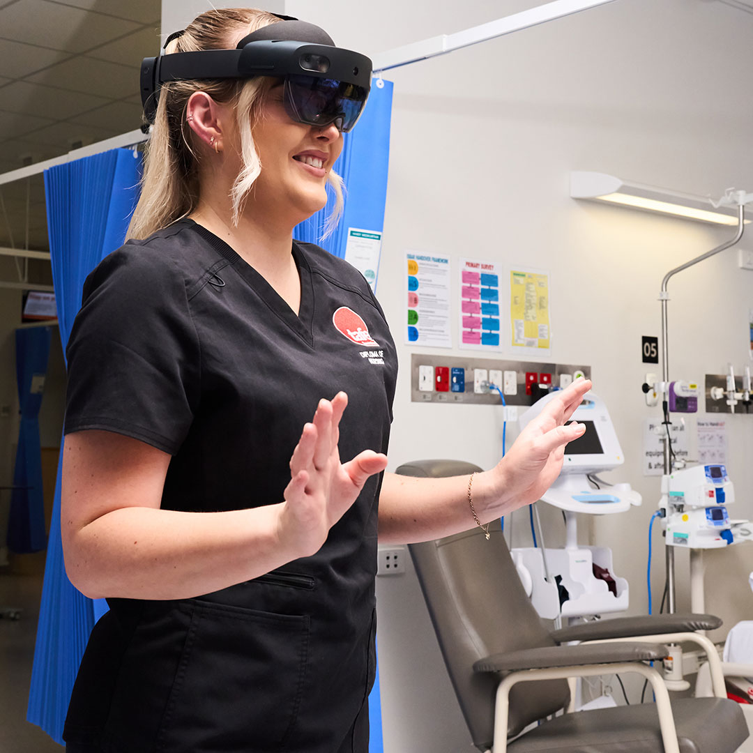 Tafe Queensland Student Nurse in Vr Headset Learning Patient Care Through Virtual Reality