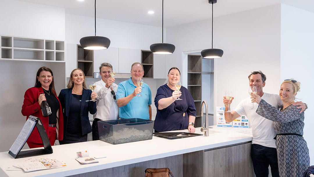 Celebrating the Sale of the Sunnykids Devcon House in Aura