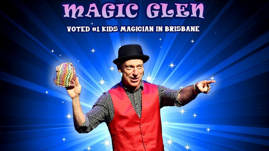 Magician in a Red Vest and Black Hat, Holding a Colorful Prop and Pointing, Against a Blue Starburst Backdrop.