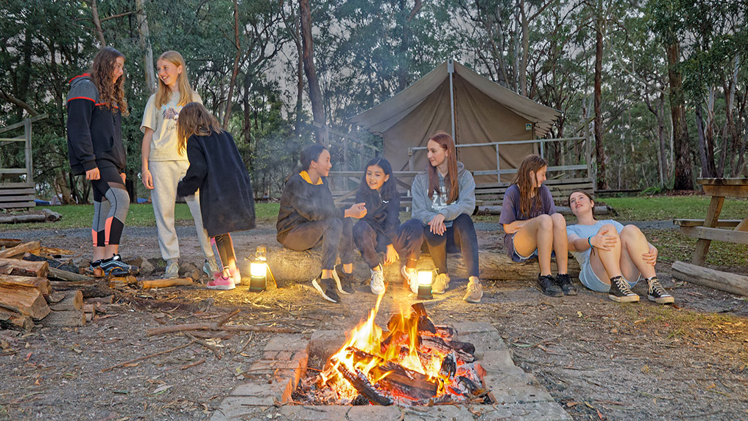 a Group of Campers Sit Around the Campfire at the Great Aussie Bush Camp, Kindilan