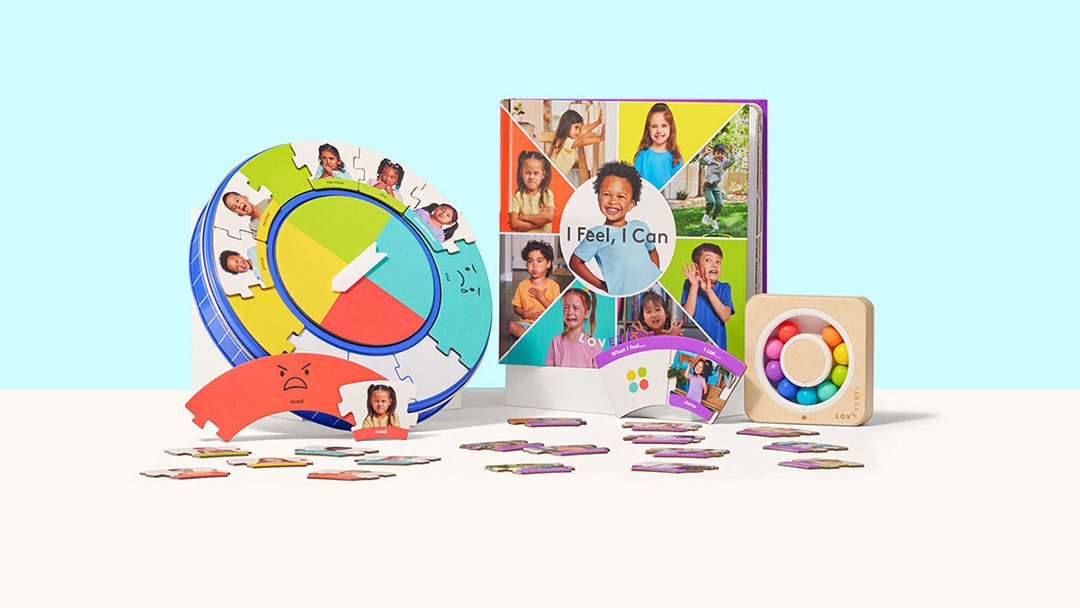 Cto-lovevery_ | Kids in Brisbane, Gold Coast, Sunshine Coast | Kotc Colorful Children's learning toys: a circular puzzle wheel, a colorful book, and a wooden bead toy with scattered card cutouts on a light surface.