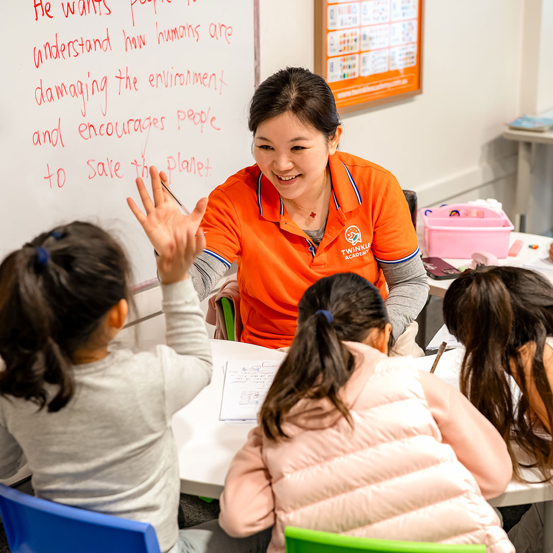 Tutor at Twinkle Academy Gold Coast Tutoring Centre Giving Students a High-five