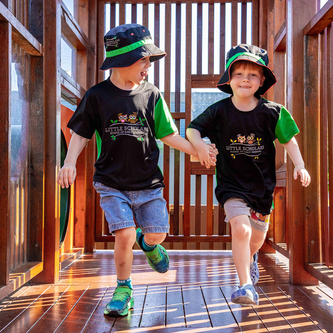 Two Students Playing Outside at Little Scholars Ormeau Village